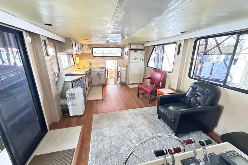 Slide: The Image of Interior of a 1999 Gibson Houseboat 50 with modern furnishings and spacious layout. - 63