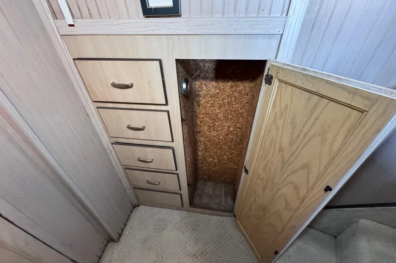 Slide: The Image of storage closet and built in drawers at the bottom of the stairway . - 69