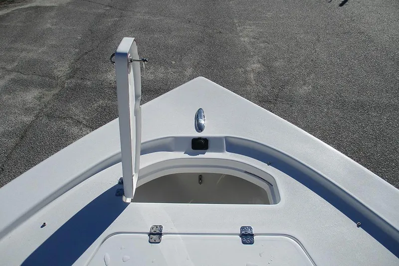 Slide: The Image of Bow view of 2026 Sea Pro 250 Bay boat with open hatch. - 12