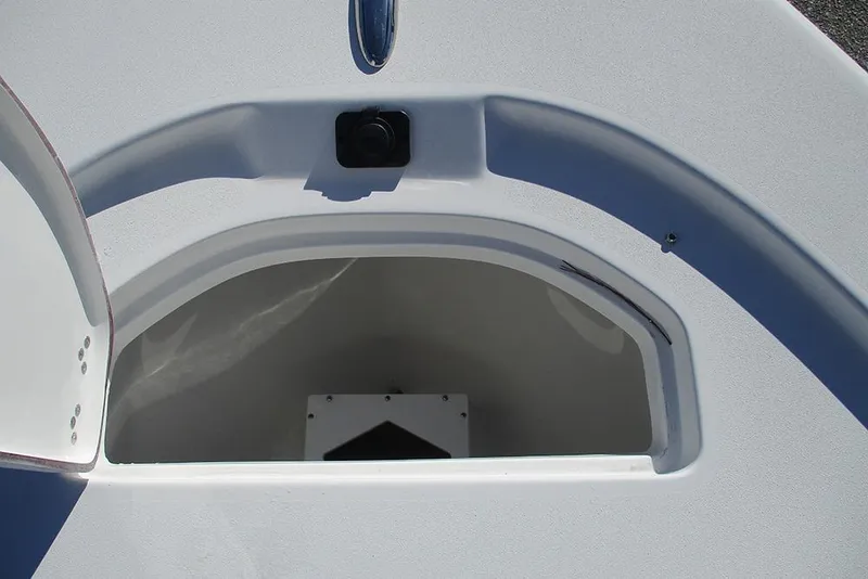 Slide: The Image of Open storage compartment on 2026 Sea Pro 250 Bay boat. - 13
