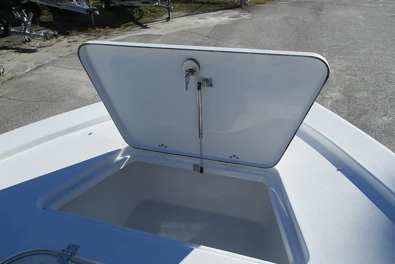 Slide: The Image of Open storage compartment on 2026 Sea Pro 250 Bay boat, showcasing interior space. - 15