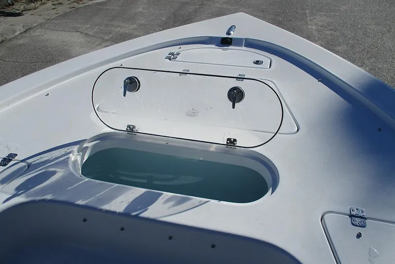 Slide: The Image of 2026 Sea Pro 250 Bay boat deck with open storage compartment. - 17