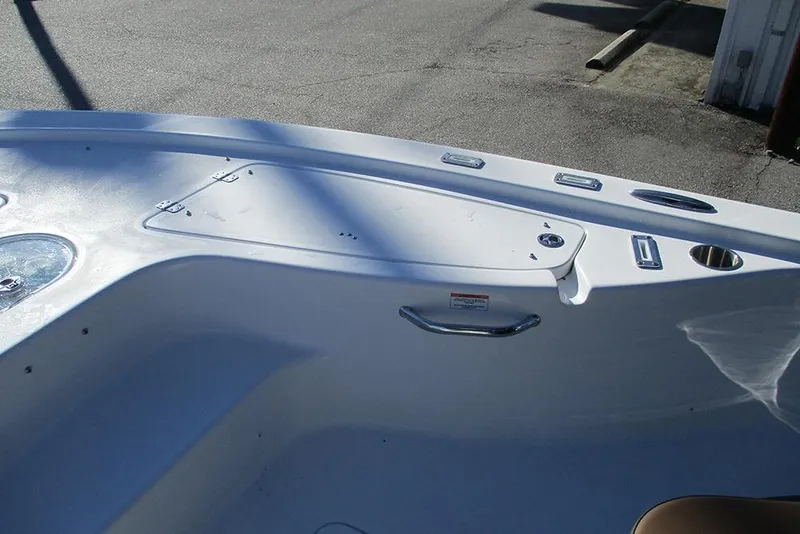 Slide: The Image of 2026 Sea Pro 250 Bay boat interior, featuring sleek white design and stainless steel fixtures. - 19