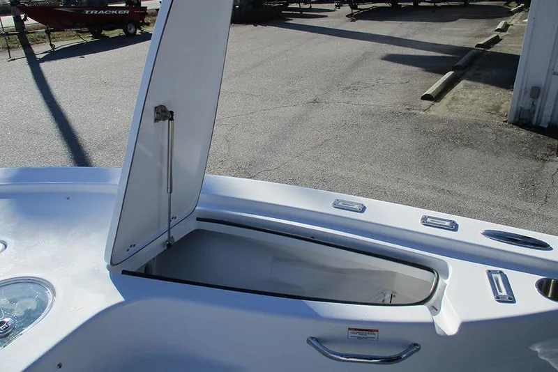Slide: The Image of 2026 Sea Pro 250 Bay boat storage compartment open, showcasing interior space. - 20