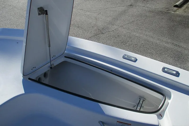 Slide: The Image of Open storage compartment on 2026 Sea Pro 250 Bay boat deck. - 21