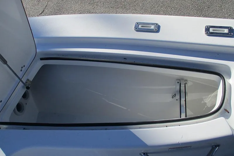 Slide: The Image of Open storage compartment on a 2026 Sea Pro 250 Bay boat. - 22
