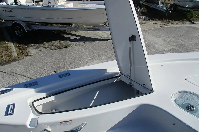 Slide: The Image of Open storage compartment on 2026 Sea Pro 250 Bay boat, showcasing interior space. - 24