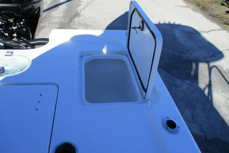 Slide: The Image of 2026 Sea Pro 250 Bay boat with open storage compartment on deck. - 27