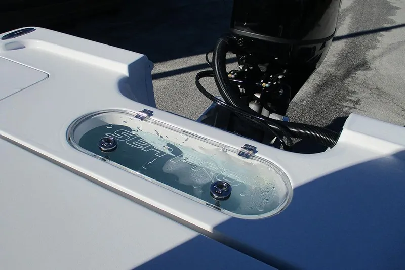 Slide: The Image of 2026 Sea Pro 250 Bay boat with livewell and outboard motor. - 29