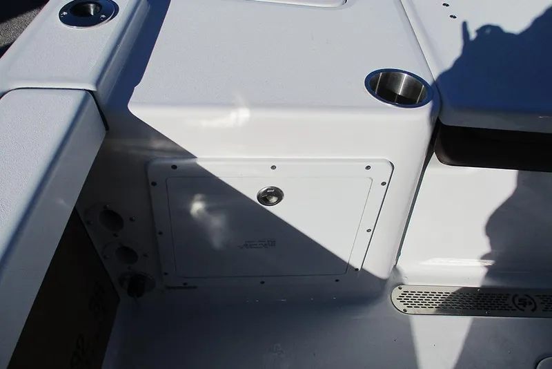 Slide: The Image of 2026 Sea Pro 250 Bay boat interior with storage compartment and cup holder. - 37