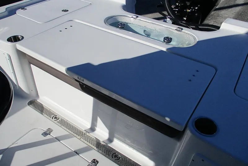 Slide: The Image of 2026 Sea Pro 250 Bay boat deck with storage compartments and livewell. - 39
