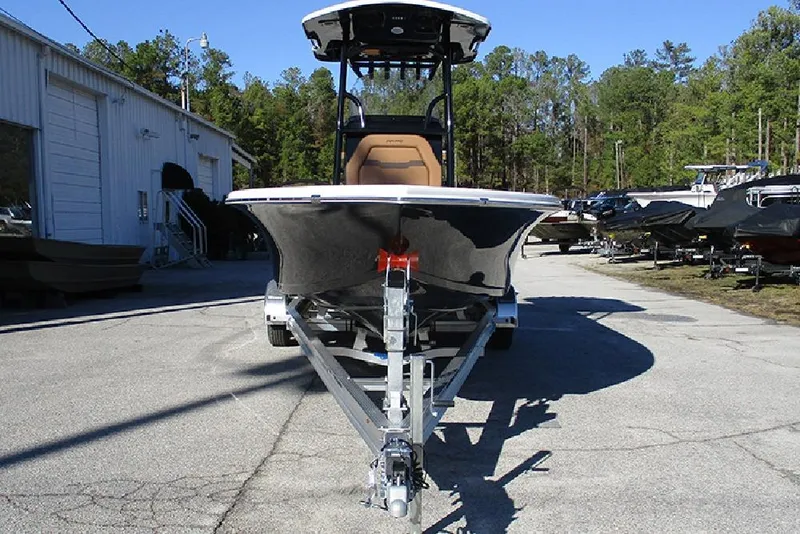 Slide: The Image of 2026 Sea Pro 250 Bay boat on trailer, parked outdoors near a building. - 4