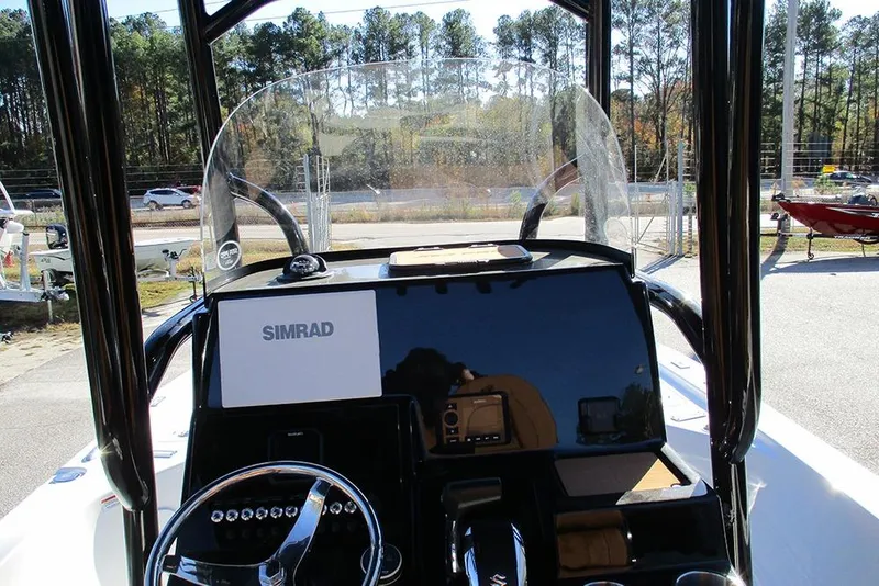 Slide: The Image of 2026 Sea Pro 250 Bay boat dashboard with Simrad navigation system. - 43