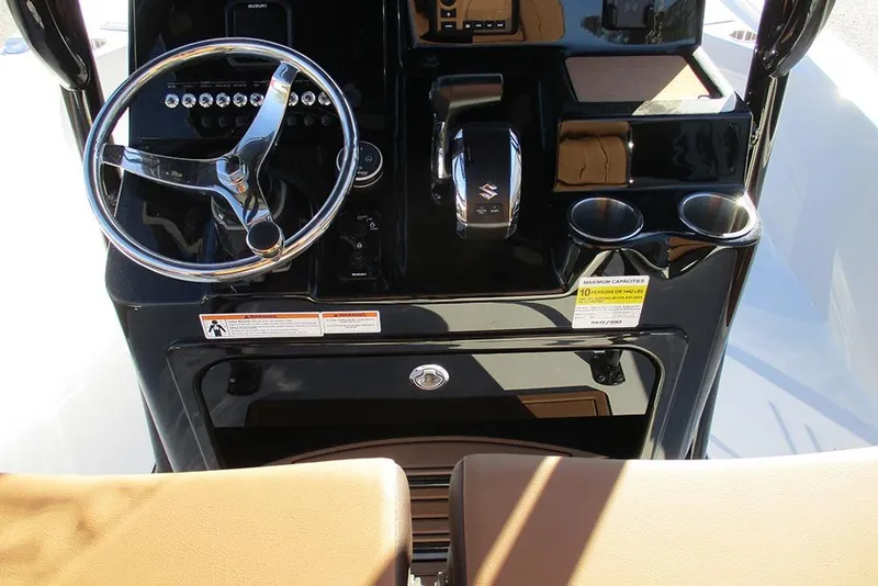 Slide: The Image of 2026 Sea Pro 250 Bay boat dashboard with steering wheel and controls. - 44