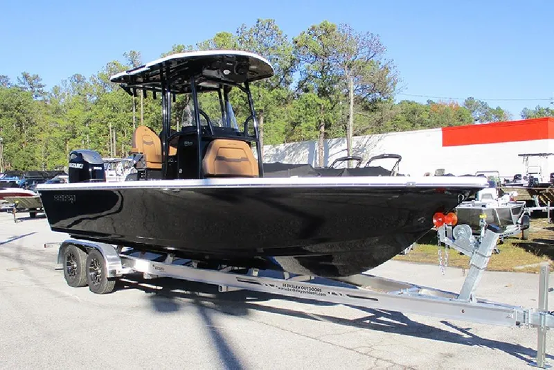 Slide: The Image of 2026 Sea Pro 250 Bay boat on trailer, black hull, parked outdoors. - 5
