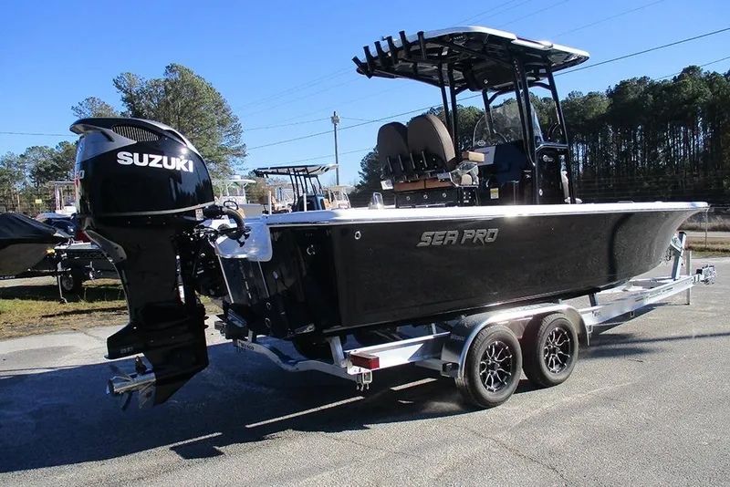 Slide: The Image of 2026 Sea Pro 250 Bay boat with Suzuki engine on a trailer. - 7