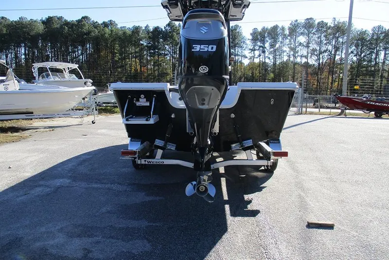 Slide: The Image of 2026 Sea Pro 250 Bay boat with Suzuki 350 engine, parked on trailer. - 8