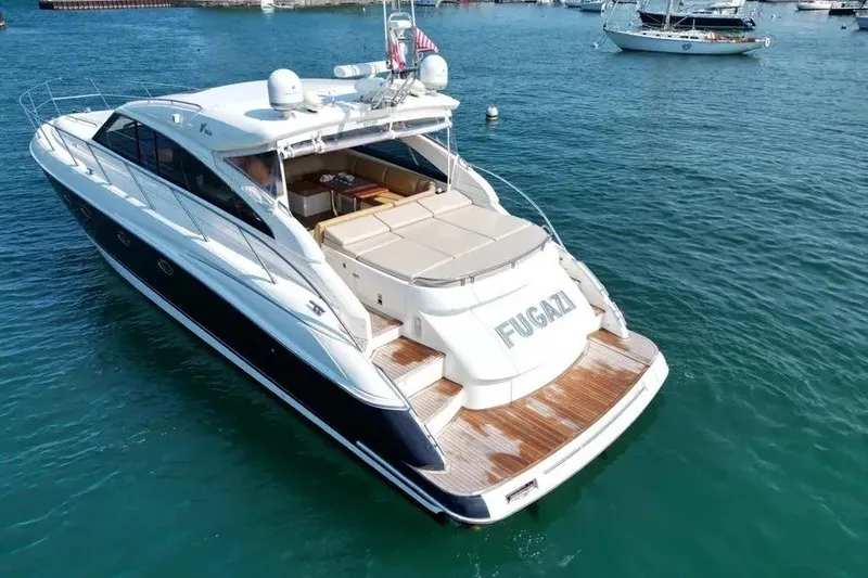 Slide: The Image of 2008 Princess V53 yacht on water, featuring sleek design and spacious deck. - 10