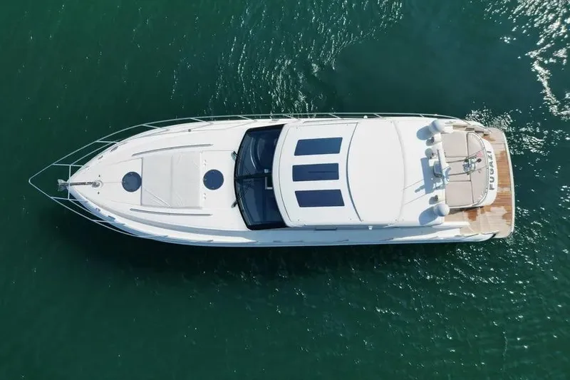 Slide: The Image of Aerial view of 2008 Princess V53 yacht on calm green water. - 11