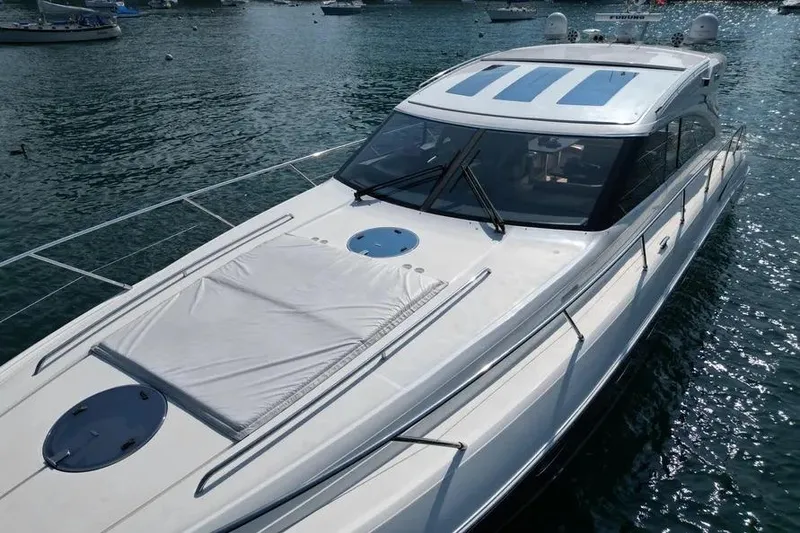 Slide: The Image of 2008 Princess V53 yacht on water, sleek design, sunroof, and spacious deck. - 12
