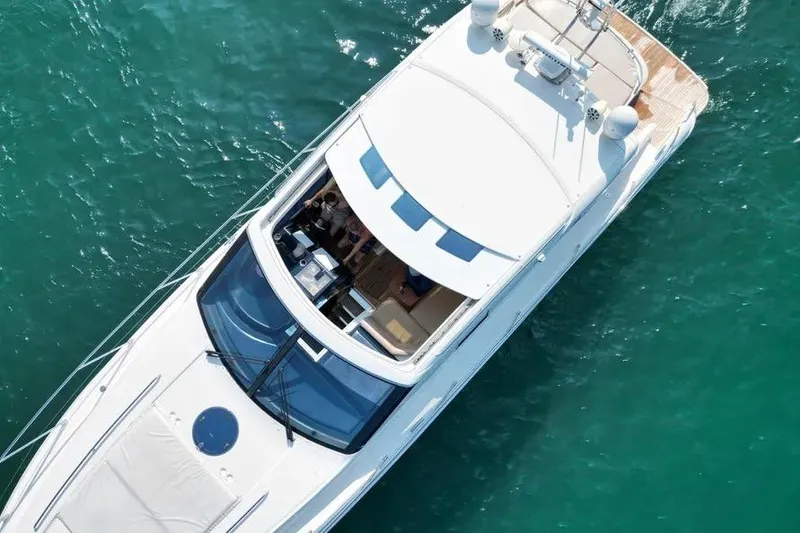 Slide: The Image of Aerial view of 2008 Princess V53 yacht on clear turquoise water. - 13