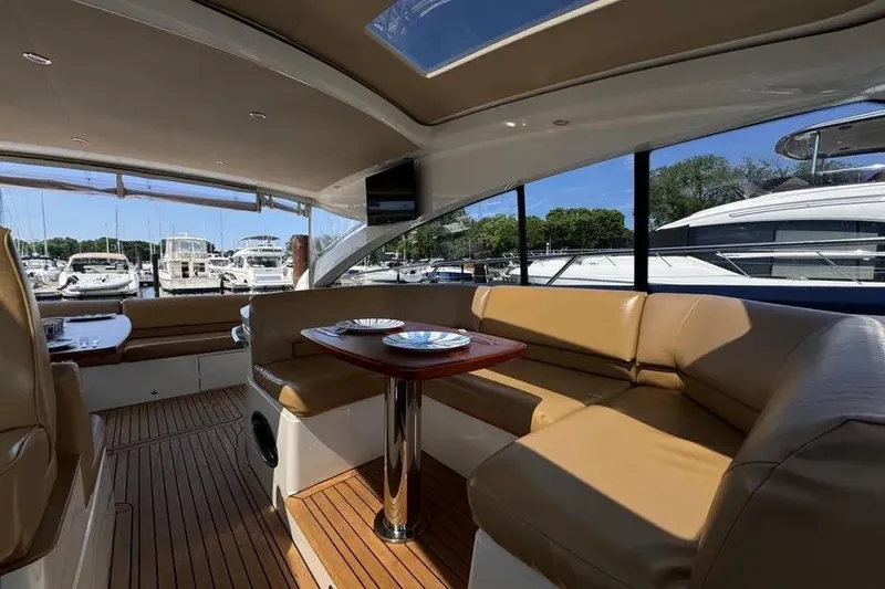 Slide: The Image of Interior of 2008 Princess V53 yacht with tan leather seating and wooden flooring. - 18
