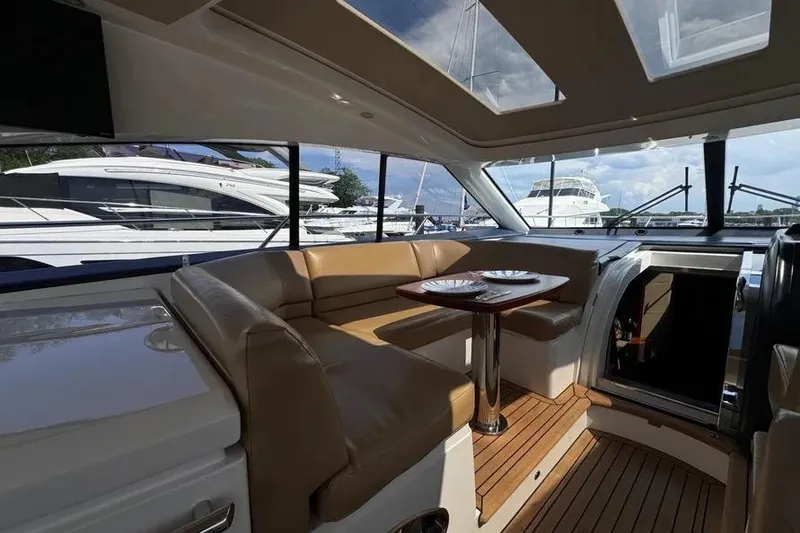 Slide: The Image of Luxurious interior of 2008 Princess V53 yacht with leather seating and wooden flooring. - 19