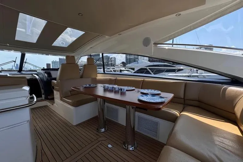 Slide: The Image of Luxurious interior of 2008 Princess V53 yacht with elegant seating and dining area. - 23