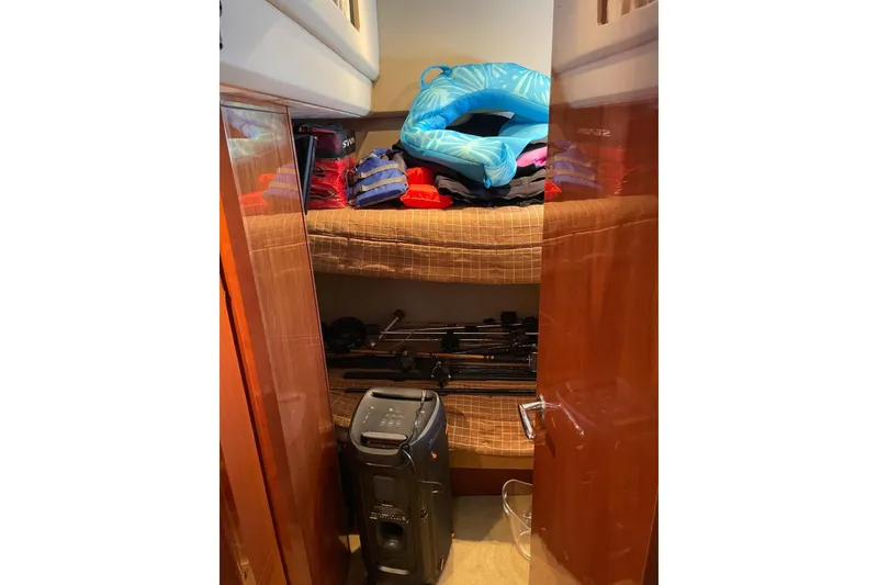 Slide: The Image of Storage area in a 2008 Princess V53 yacht with life jackets and equipment. - 34