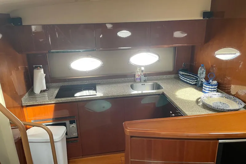 Slide: The Image of Luxurious kitchen interior of 2008 Princess V53 yacht with modern amenities and sleek design. - 36