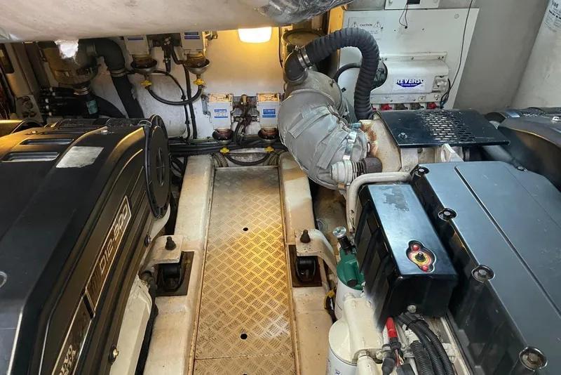 Slide: The Image of Engine room of a 2008 Princess V53 yacht, showcasing mechanical components and systems. - 40