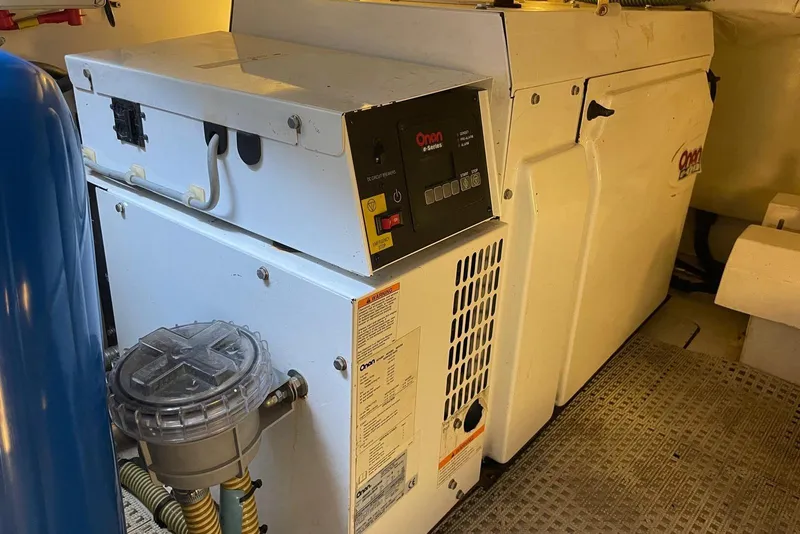 Slide: The Image of Engine room of a 2008 Princess V53 yacht featuring an Onan generator. - 46