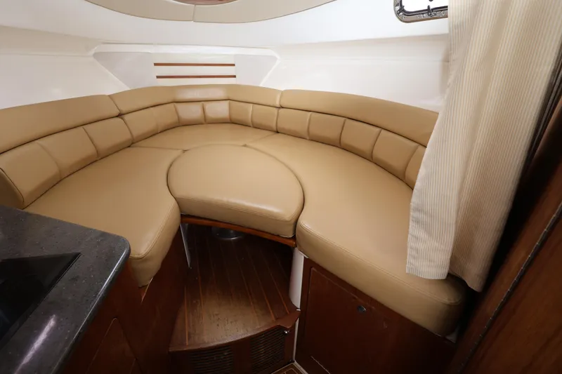 Slide: The Image of Luxurious interior of 2011 Everglades 320EX boat with tan leather seating. - 18