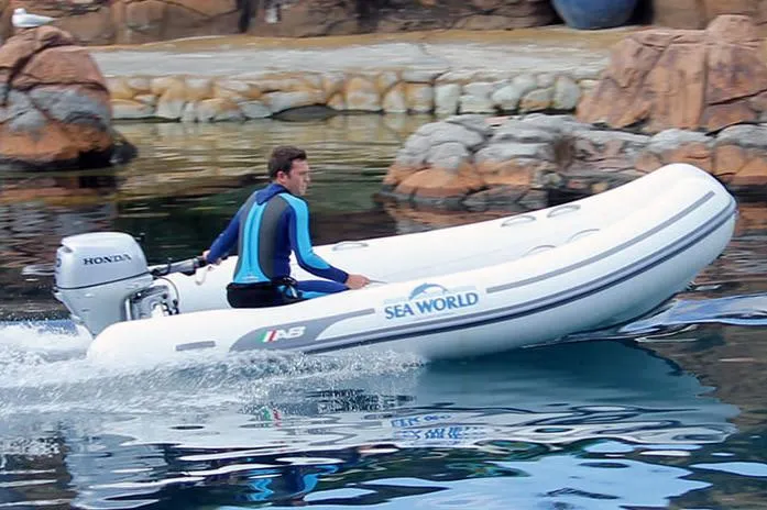 Slide: The Image of Manufacturer Provided Image: Man driving 2025 AB Inflatables Ventus 12 VL boat at Sea World. - 1
