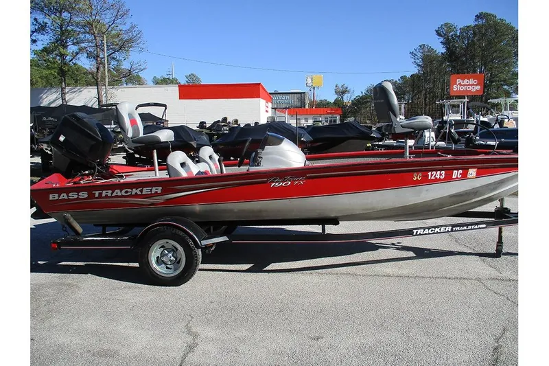 The Image of 2007 Tracker Pro Team 190 TX bass boat on trailer, red and silver design. - 0