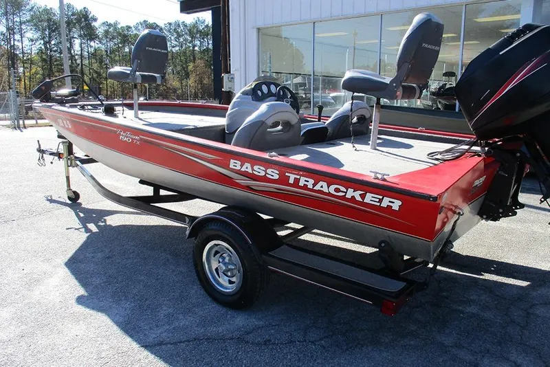 Slide: The Image of 2007 Tracker Pro Team 190 TX bass boat on trailer, parked outdoors. - 3
