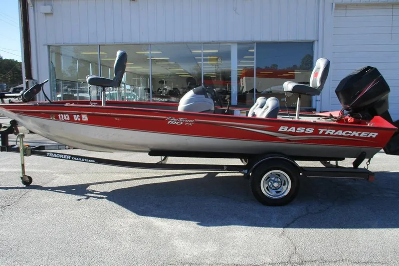 Slide: The Image of 2007 Tracker Pro Team 190 TX bass boat on trailer, parked outside dealership. - 4