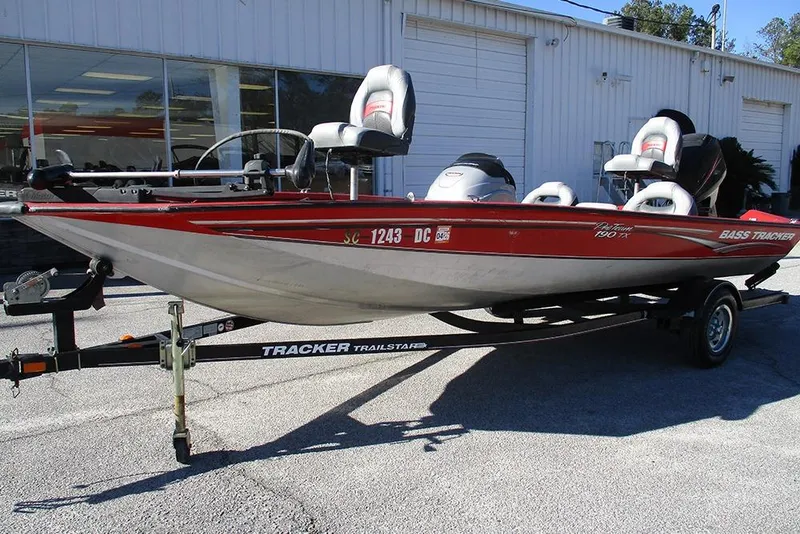 Slide: The Image of 2007 Tracker Pro Team 190 TX fishing boat on trailer, parked outside a building. - 5