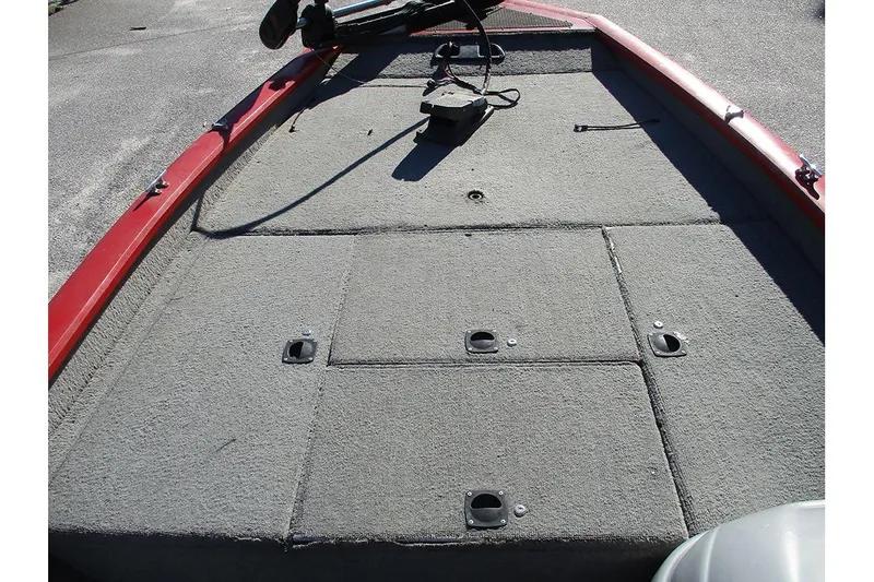 Slide: The Image of 2007 Tracker Pro Team 190 TX boat deck with carpeted storage compartments. - 8