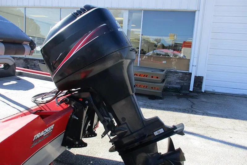 Slide: The Image of 2007 Tracker Pro Team 190 TX boat with Mercury outboard motor, parked outside dealership. - 9