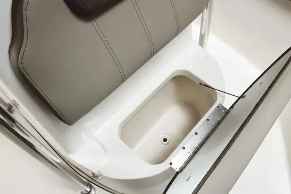 Slide: The Image of 2026 Key West 203 FS boat seat with storage compartment open. - 3