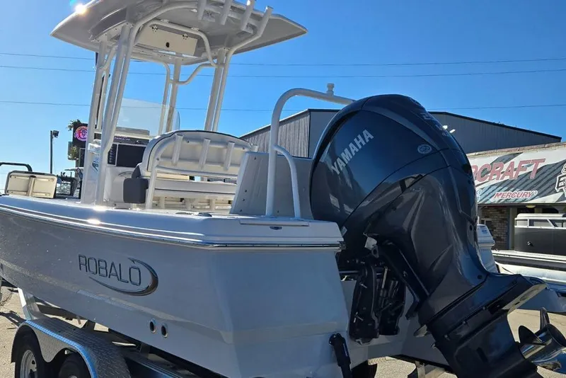 Slide: The Image of 2026 Robalo 246 Cayman boat with Yamaha outboard motor, displayed outdoors. - 3