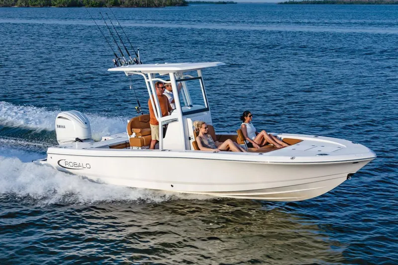 Slide: The Image of Manufacturer Provided Image: 2025 Robalo 246 Cayman boat cruising on open water with passengers. - 7