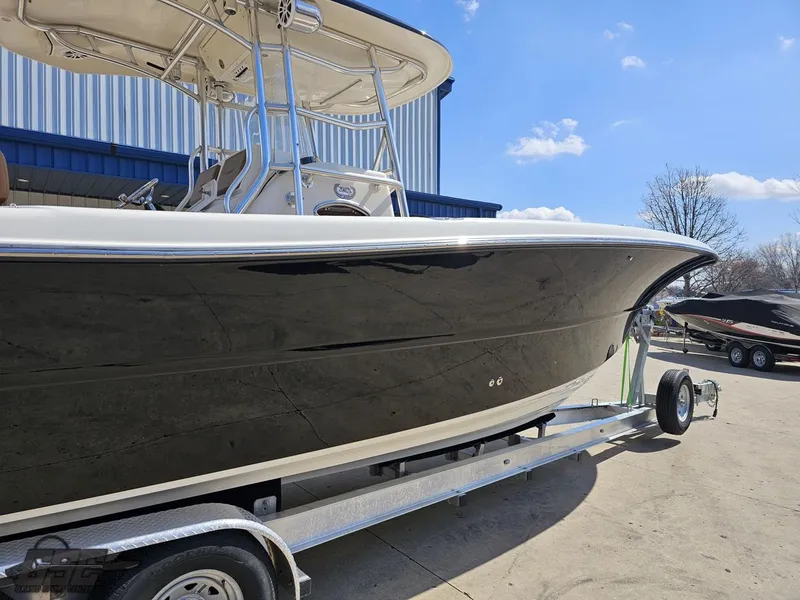 Slide: The Image of 2007 Triton 351 CC boat on a trailer, side view. - 11