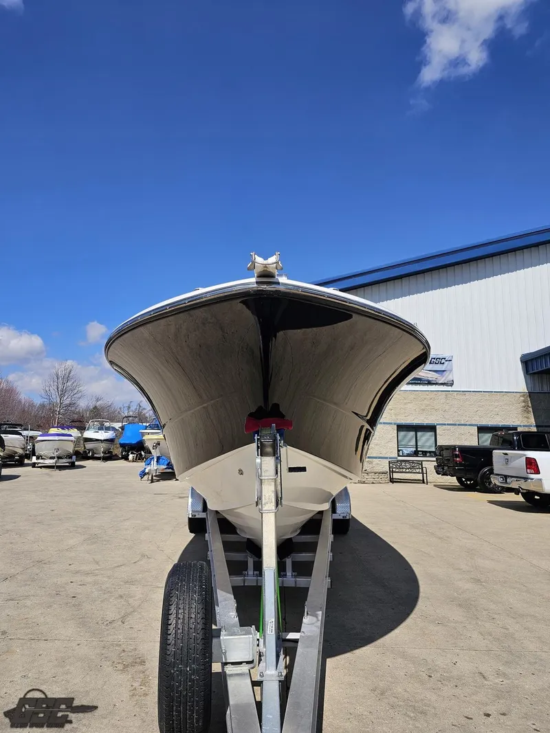 Slide: The Image of 2007 Triton 351 CC boat on trailer in outdoor lot. - 18