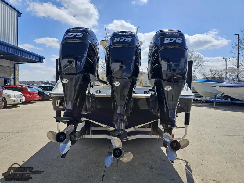 Slide: The Image of 2007 Triton 351 CC boat with triple 275 HP outboard engines. - 29