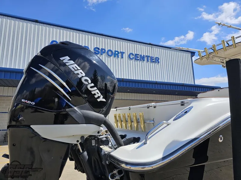 Slide: The Image of 2007 Triton 351 CC boat with Mercury outboard motor at a sport center. - 30
