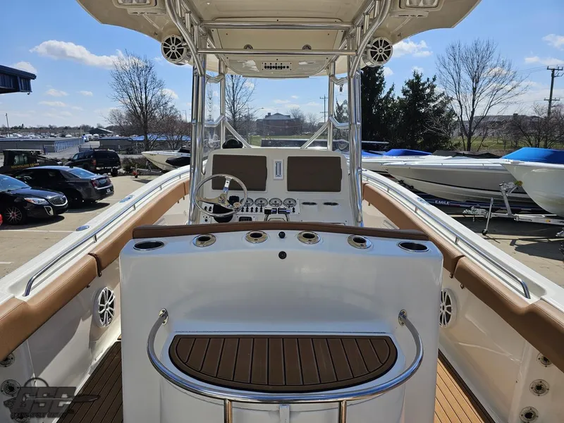 Slide: The Image of 2007 Triton 351 CC boat interior with helm station and seating. - 38