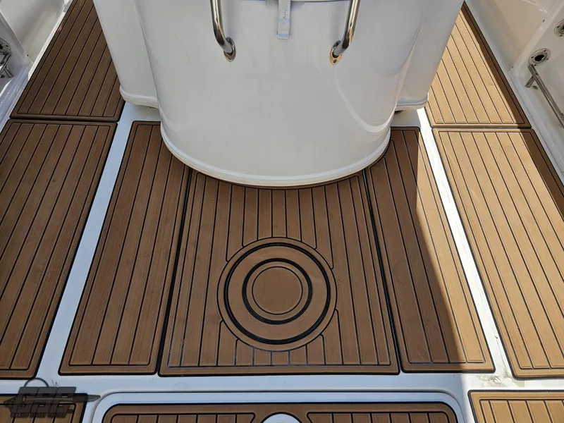 Slide: The Image of 2007 Triton 351 CC boat deck with teak flooring. - 41