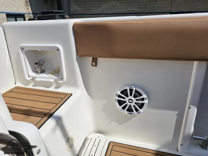 Slide: The Image of 2007 Triton 351 CC boat interior with speaker and storage compartment. - 42